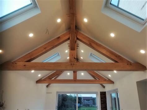 Oak trusses and hipped roof structure - The Timber Cooperative