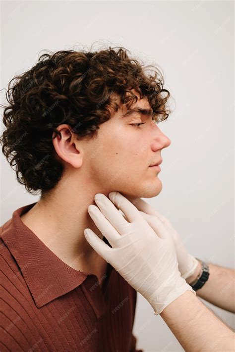 Premium Photo | ENT doctor palpates the neck to determine inflammation