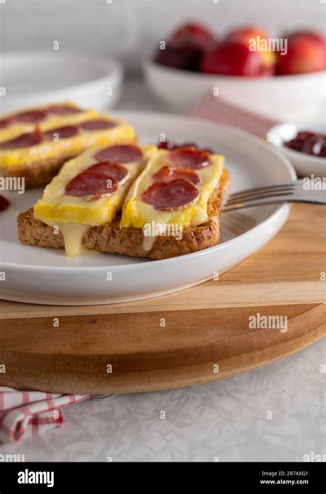open faced grilled cheese sandwich  brie spanish salami served