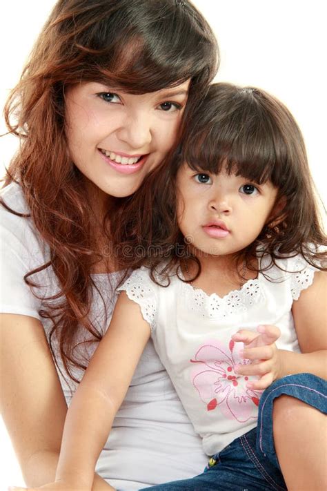 Smiling mom and daughter stock photo. Image of isolated - 22568008
