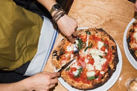 Premium Photo | Eating pizza