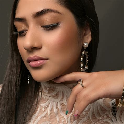 person wearing  heart shape earring  stock photo