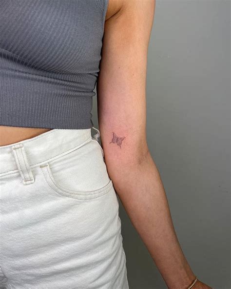 Fine line butterfly tattoo done on the inner forearm.