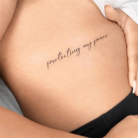 "Protecting my peace" lettering tattoo located on the