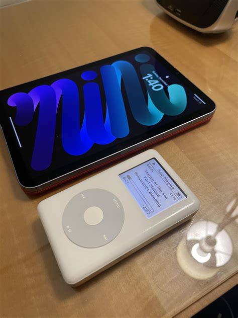 My favorite tech travel companions, purple iPad mini 6 and my modded 4th gen iPod. What is