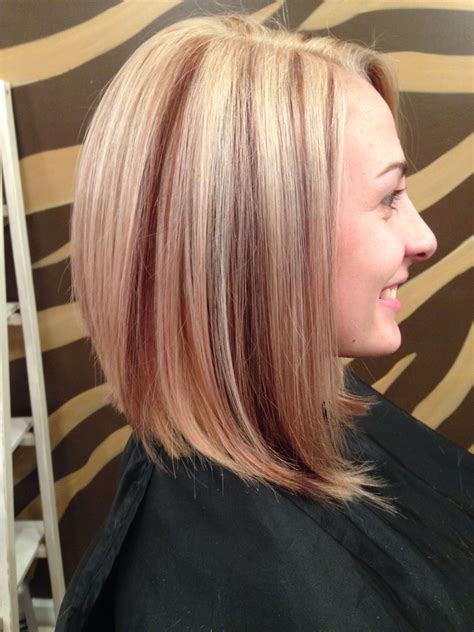 Stylists explain why red hair with brown lowlights works for everyone