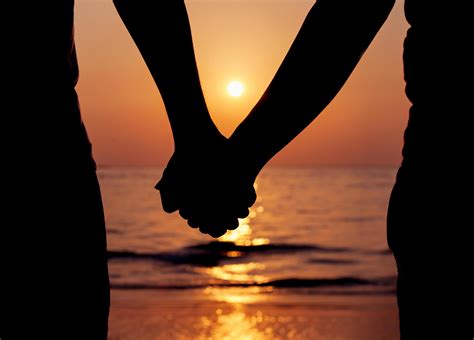 Silhouette of a couple holding hands at sunset 2004206 Stock Photo at ...