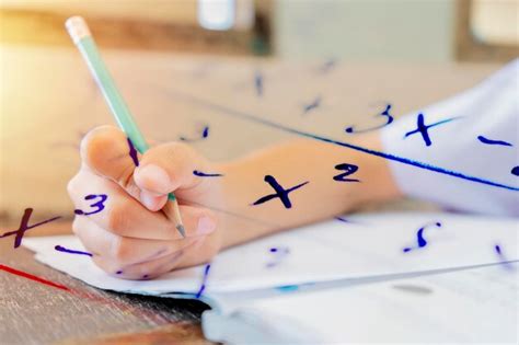 Premium Photo | Students who are holding pencils for math calculation ...