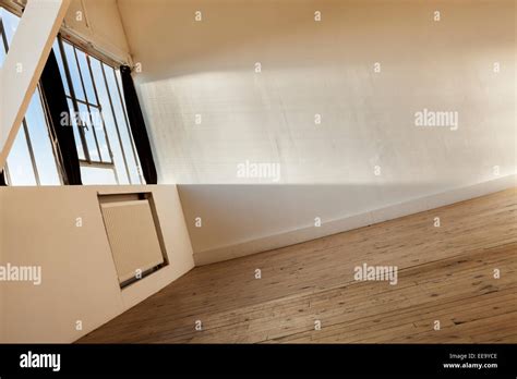 wide loft, beams and wooden floor Stock Photo - Alamy