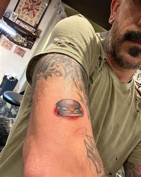 Backstreet Boys: AJ McLean gets a hamburger tattoo in Sydney | Daily ...
