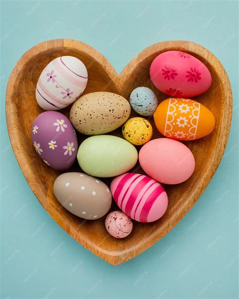 Free Photo | Top view of colorful easter eggs in heart-shaped plate