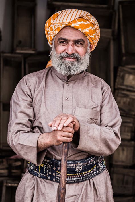 Download Smiling Old Arab Man Wearing Turban Wallpaper | Wallpapers.com