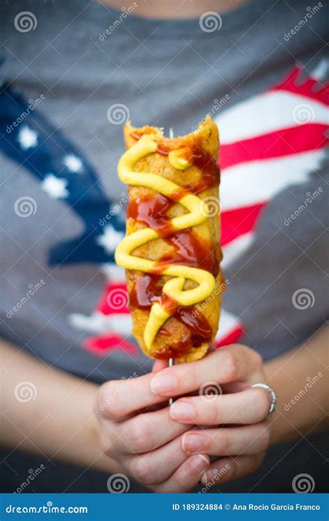 Close Up of Caucasian Woman Hands Holding a Corn Dog Stock Photo ...