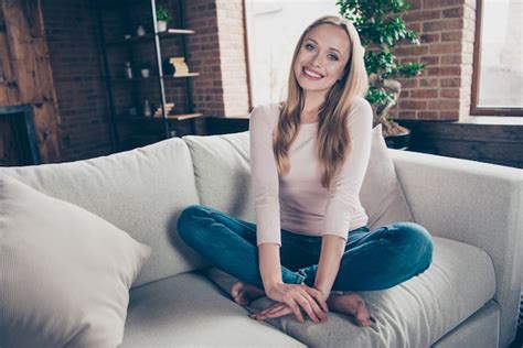 portrait woman sitting  couch premium photo