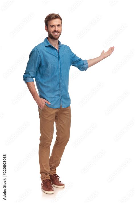 full body picture of a young casual man presenting Stock Photo | Adobe ...