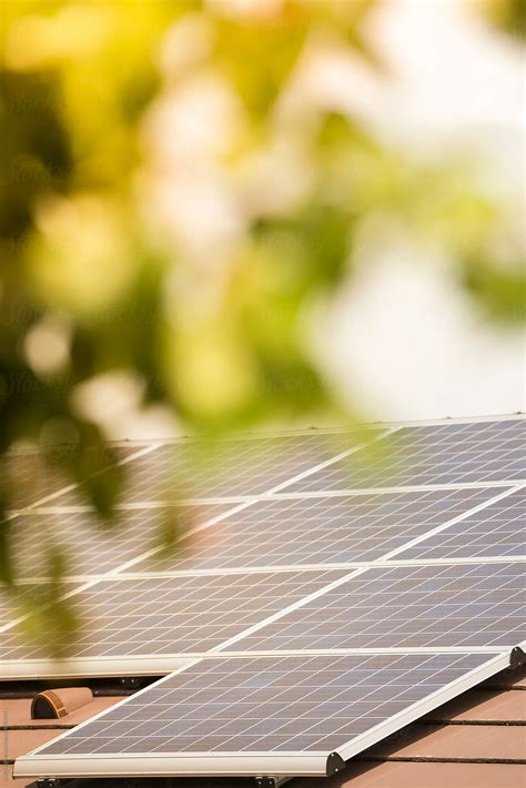 "Solar Roof Panels On A House." by Stocksy Contributor "Craig Holmes