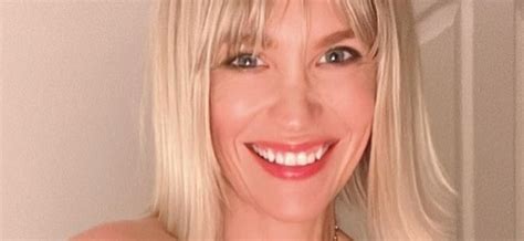 January Jones Unzips Her Top With Nothing Underneath