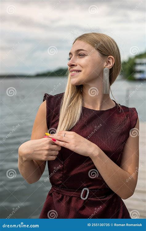 Beautiful Blond Girl in a Long Dark Red Dress Posing on the Pond Stock Image - Image of lady ...