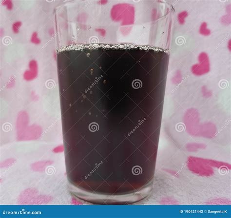 Water Condensation and a Glass with Soft Drink Stock Image - Image of