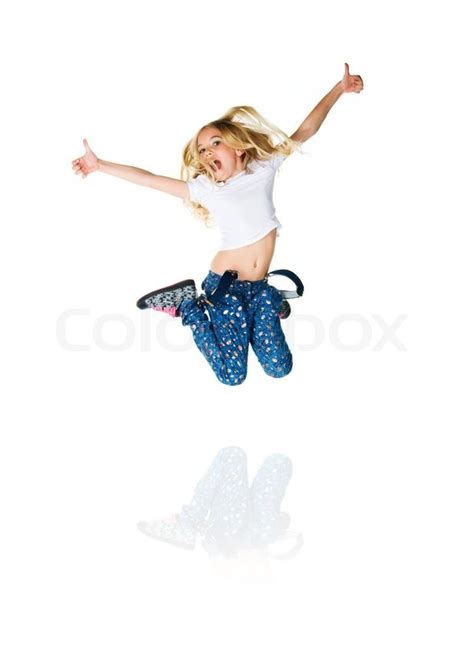 Cute little girl jump. Studio shot. ... | Stock Photo | Colourbox