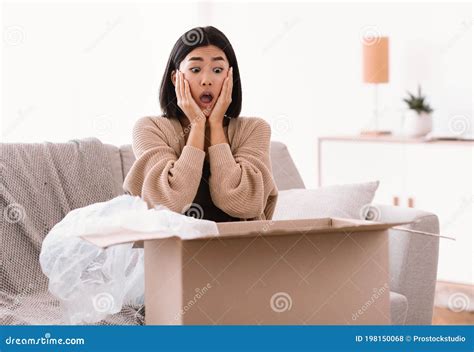Surprised Young Lady Unpacking Wrong Parcel, Delivery Mistake Stock ...