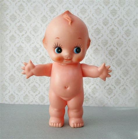A very adorable vintage kewpie doll with moving arms and legs. Measures ...