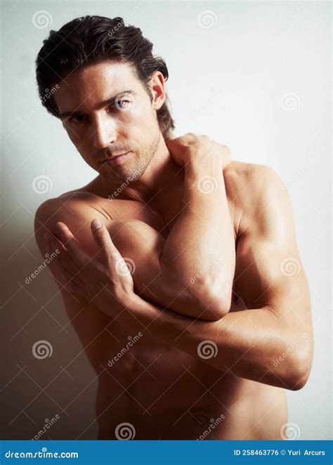The Perfect Male Form. Portrait of a Semi-nude Young Man Leaning