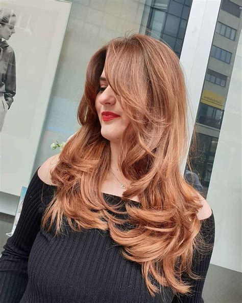 Women are debating the best face shape for long layer cut hairstyle 11