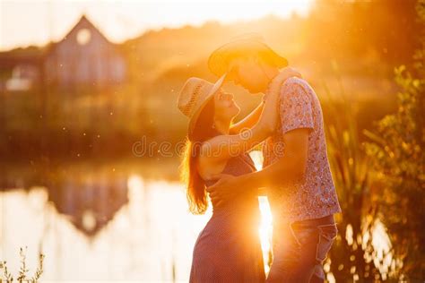Portrait of Brunette Woman and Man Kissing and Embracing Face To Face