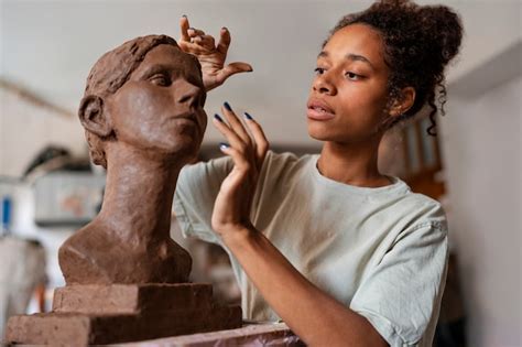 Free Photo | Side view woman clay sculpting