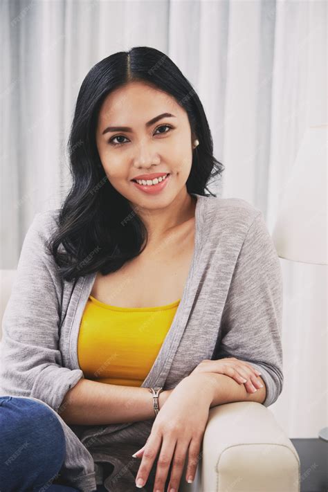 Free Photo | Young Filipino woman sitting on couch