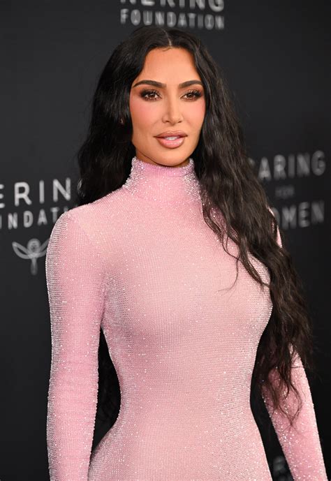 Kim Kardashian shows off six-pack in tiny bra for grueling at-home