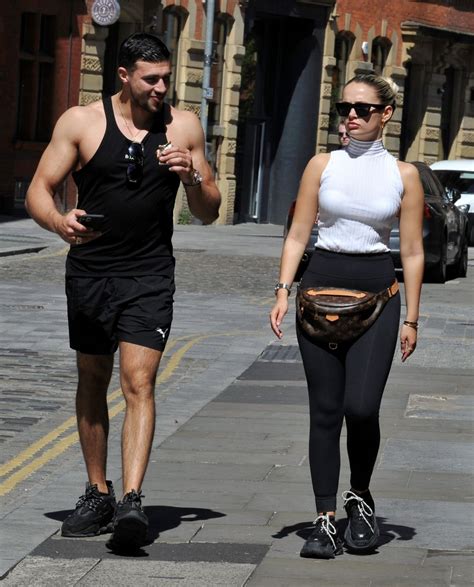 Molly Mae Hague in a White Sleeveless Turtleneck Top With Black