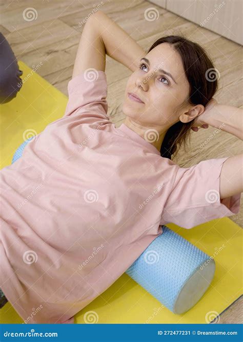 Physical Therapist Assisting Young Woman Remove Shoulders and Back Pain