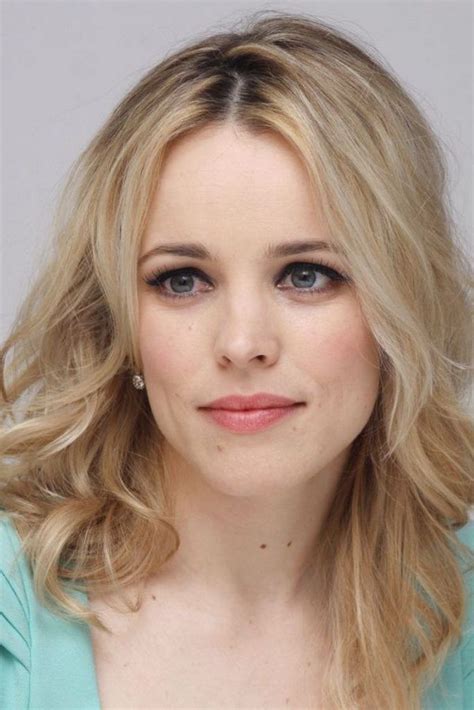 a woman with blonde hair and blue eyes