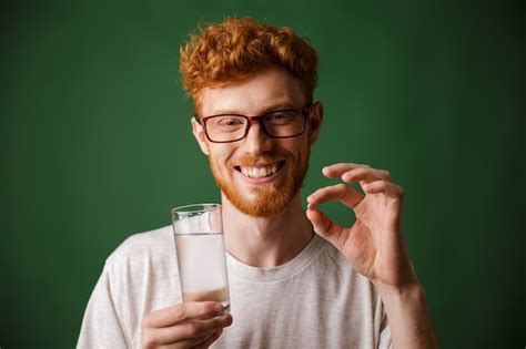 Free Photo | Portrait of a smiling young redhead man in eyeglasses