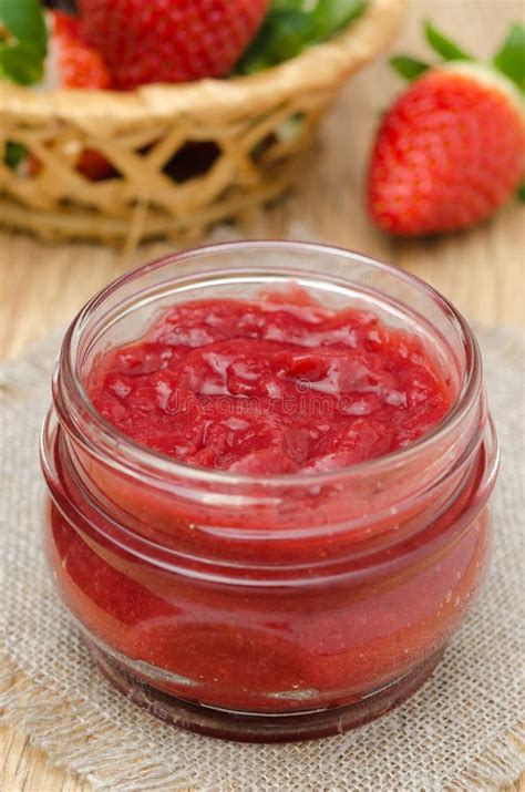 strawberry jam   glass jar  fresh strawberries stock photo
