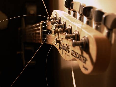 artistic view  guitar headstock  dark surrounding  loose