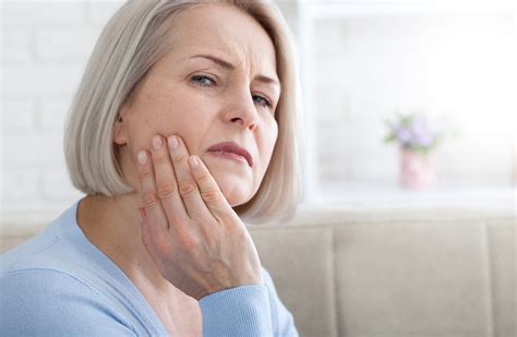 Teeth problem. Woman feeling tooth pain. Closeup of beautiful middle
