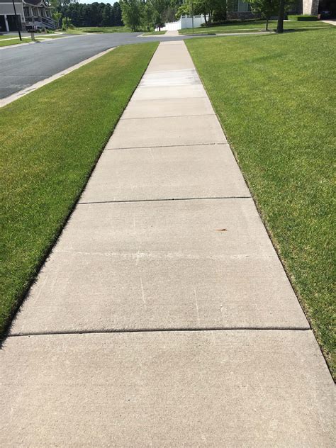 Download Taking a leisurely stroll on a sidewalk. | Wallpapers.com