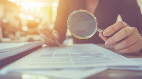 woman     magnifying glass  read  document