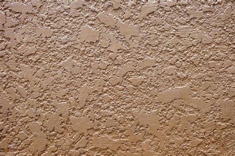Brown Stucco Texture Wall Background with Light Leak from the Top