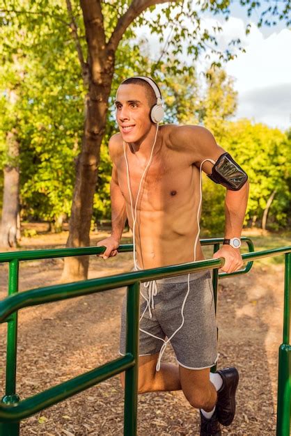 premium photo muscular young man   workout   street