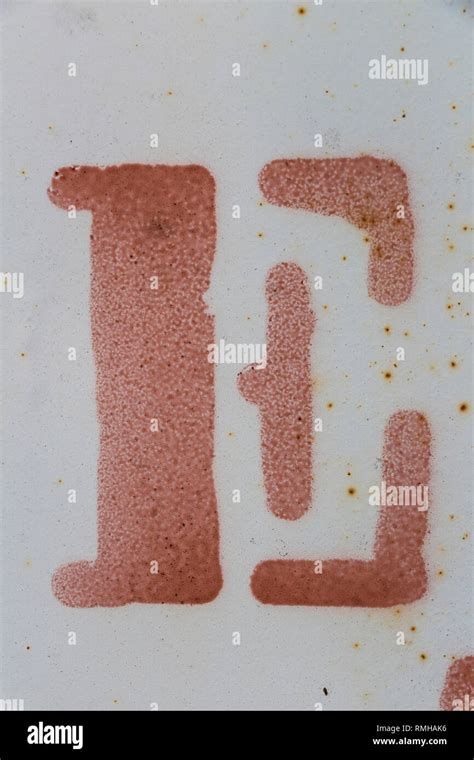 letter E painted on grungy surface, isolated, red letter, white ...