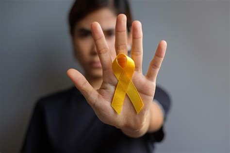 Premium Photo | Close-up of woman holding yellow flower