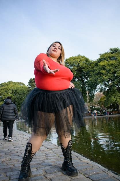 Premium Photo | Young beautiful plus size latina woman posing in park