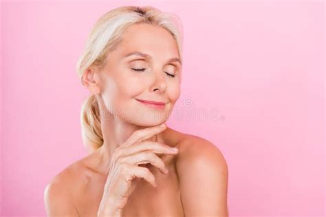 lovely dreamy retired lady naked shoulders stock