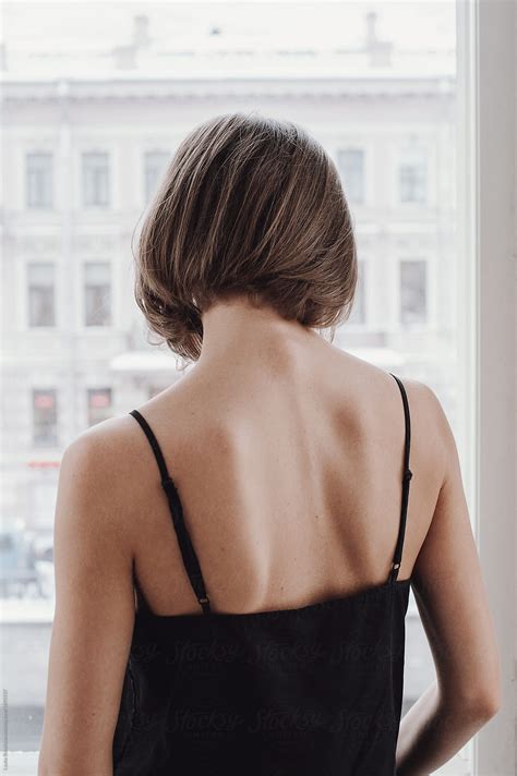 "Back View Of A Woman With Short Haircut" by Stocksy Contributor "Amor