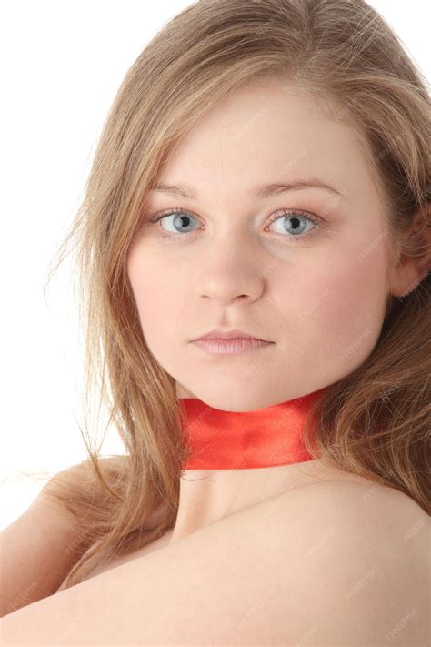 Premium Photo | Portrait of beautiful young woman wearing red ribbon on