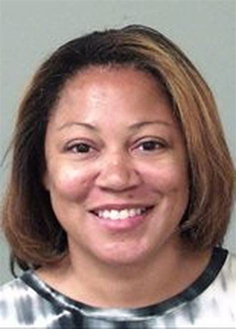 Booked: Former Huntsville principal, ex-wife of slain colonel charged